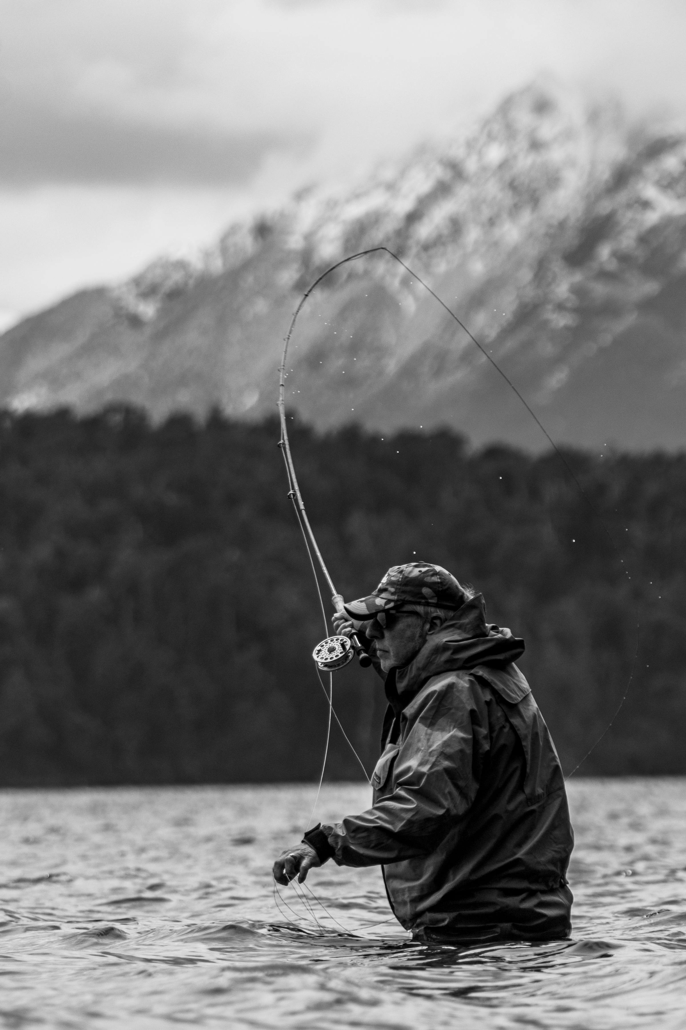 A fly fisher in a remote landscape