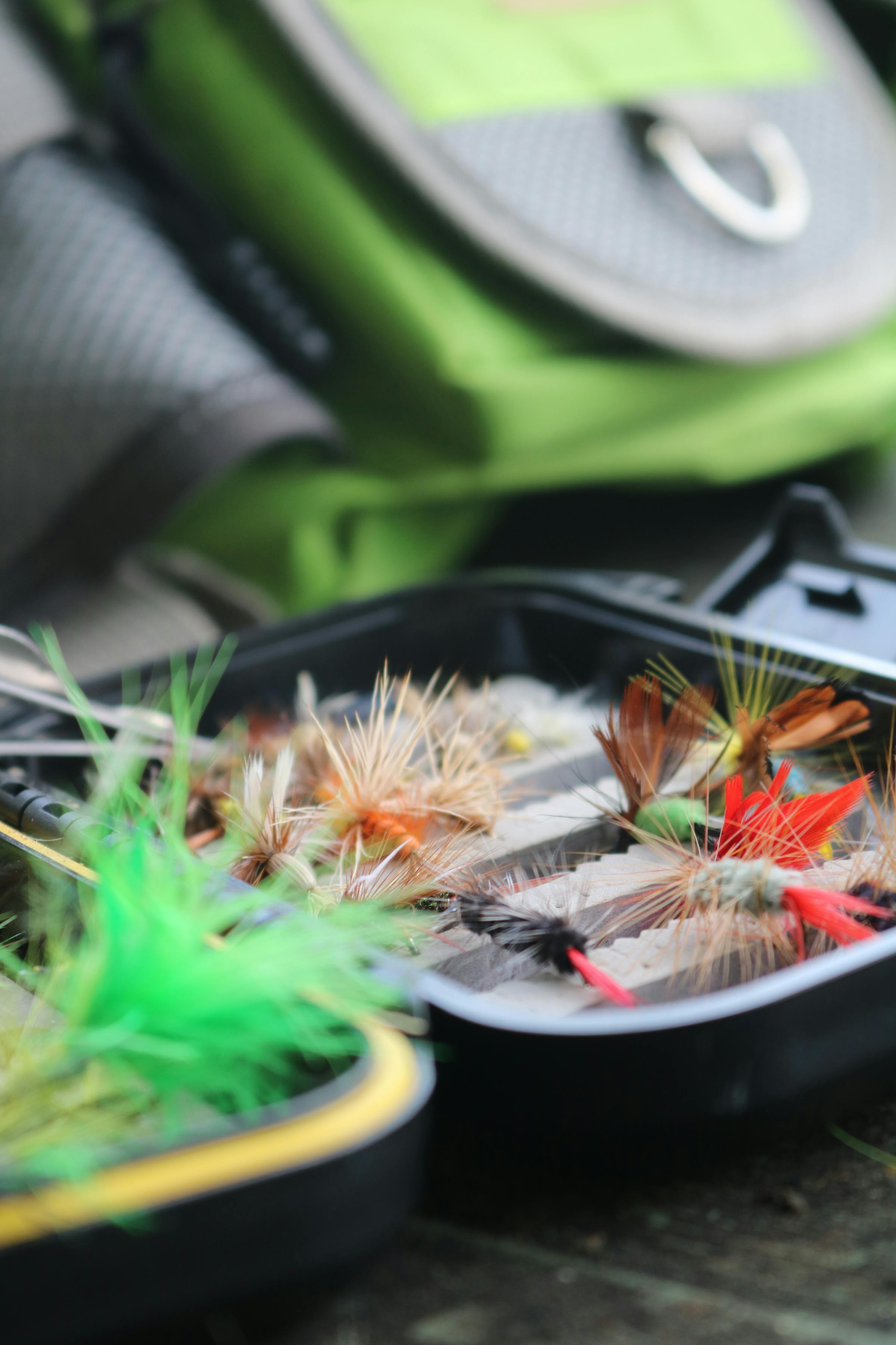 A tackle box of hand-tied fly fishing flies